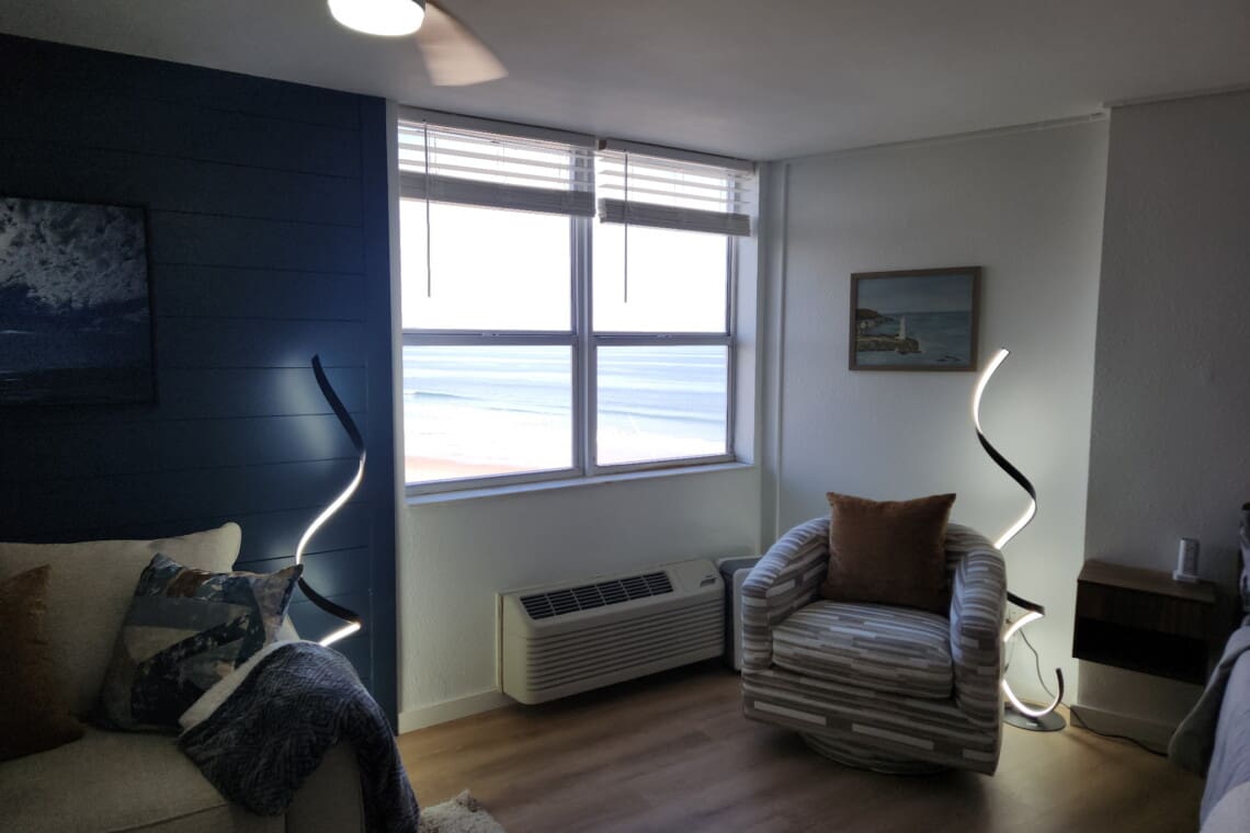 cozy reading swivel chair with a view out over the ocean and boardwalk