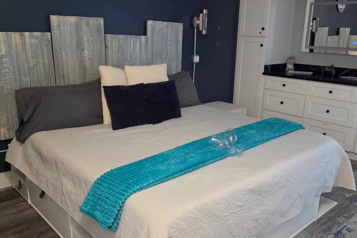 King bed with a full wardrobe for getting ready on those date nights