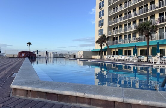 heated pool, lounge chairs, tables and umbrellas. This is your place